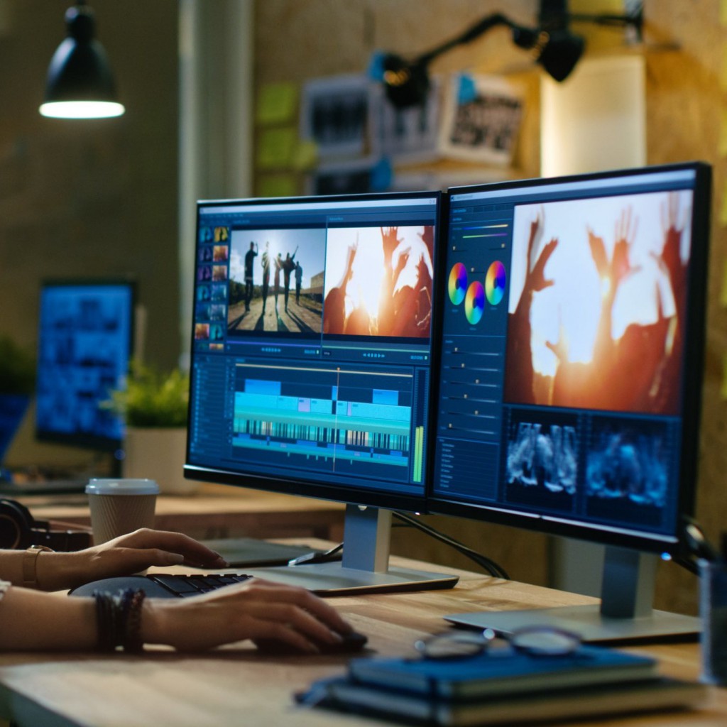 Beautiful Female Video Editor Works with Footage on Her Personal Computer, She Works in Creative Office Studio.